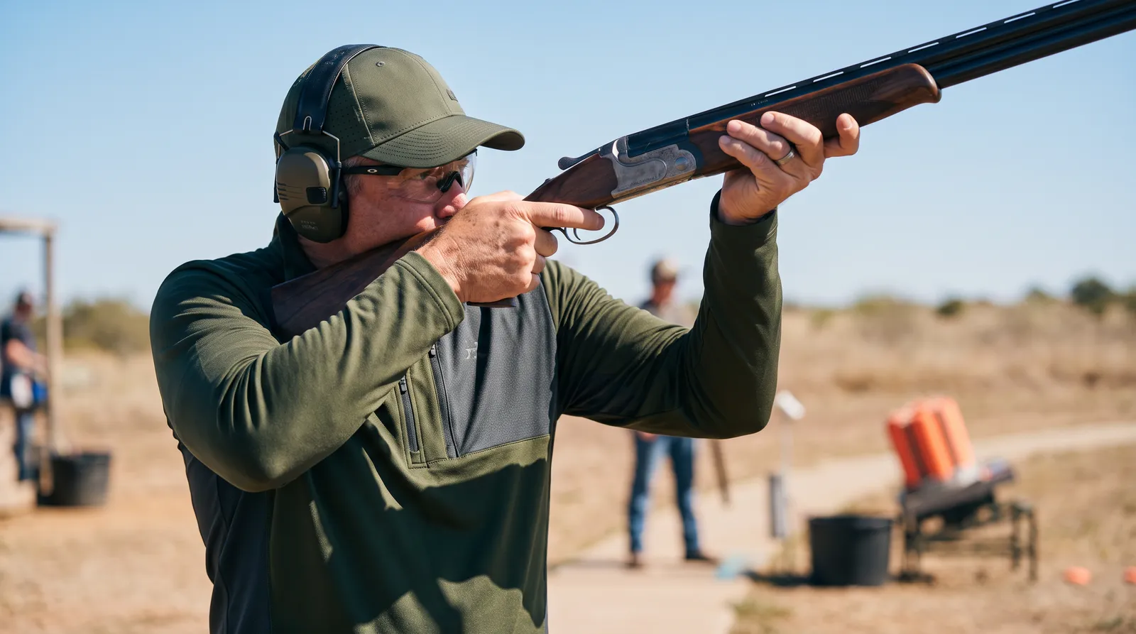 Competitive sporting clays shooter wearing Sight Line technical performance apparel